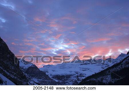 Sunset over snow covered mountains, Mount Victoria, Victoria Glacier, Banff National Park, Alberta, Canada View Large Photo Image Stock Photo - Sunset over snow covered mountains, Mount Victoria, Victoria Glacier, Banff National Park, Alberta, Canada. Fotosearch