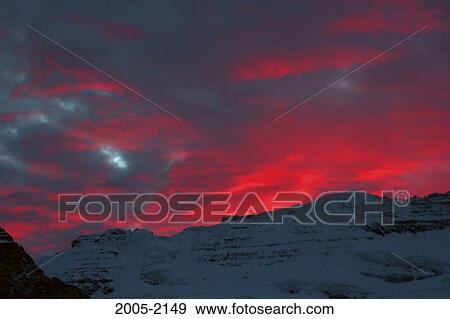 Stock Photo - Sunset over snow covered mountains, Mount Victoria, Banff National Park, Alberta, Canada. Fotosearch