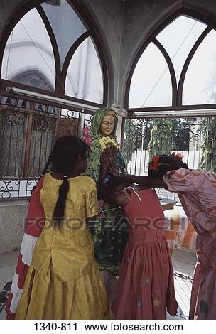 Three girls worshipping in a cathedral, Santhome Basilica, Santhome, Chennai, Tamil Nadu, India View Large Photo Image Stock Image - Three girls worshipping in a cathedral, Santhome Basilica, Santhome, Chennai, Tamil Nadu, India. Fotosearch