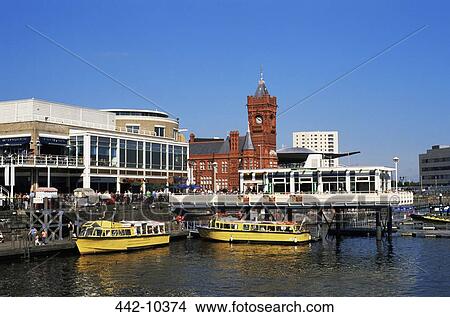 Tourboats moored near a clock tower, Cardiff Bay, Cardiff, Monmouthshire, Wales View Large Photo Image Picture - Tourboats moored near a clock tower, Cardiff Bay, Cardiff, Monmouthshire, Wales. Fotosearch
