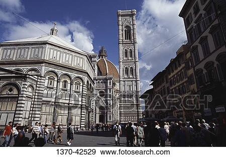Tourists walking on the road in front of a cathedral, Duomo Santa Maria del Fiore, Florence, Tuscany, Italy View Large Photo Image Stock Photo - Tourists walking on the road in front of a cathedral, Duomo Santa Maria del Fiore, Florence, Tuscany, Italy. Fotosearch