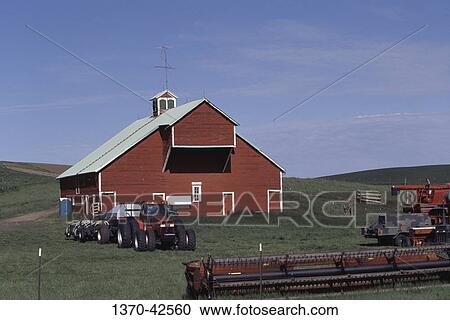 Tractor in front of a barn, Genesee, Idaho, USA View Large Photo Image Stock Image - Tractor in front of a barn, Genesee, Idaho, USA. Fotosearch