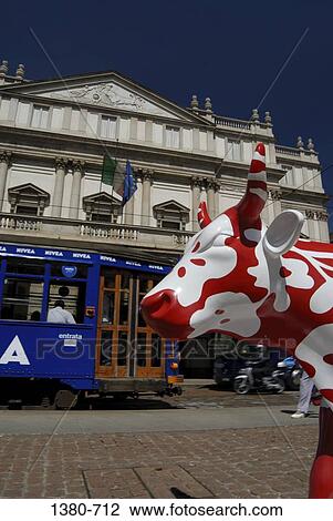 Stock Image - Tram in front of an opera house, La Scala Theater, Milan, Lombardy, Italy. Fotosearch