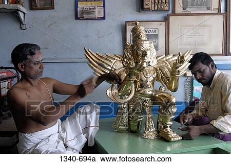 Two sculptors making a bronze sculpture of Garuda the vahana of Lord Vishnu in Hindu mythology, Kumbakonam, Thanjavur District, Tamil Nadu, India View Large Photo Image Stock Image - Two sculptors making a bronze sculpture of Garuda the vahana of Lord Vishnu in Hindu mythology, Kumbakonam, Thanjavur District, Tamil Nadu, India. Fotosearch