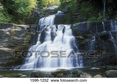 Stock Image - Waterfall in a forest, Kent Falls, Kent Falls State Park, Kent, Connecticut, USA. Fotosearch