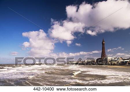Waves in the sea with a tower in the background, Blackpool Tower, Blackpool, Lancashire England View Large Photo Image Stock Image - Waves in the sea with a tower in the background, Blackpool Tower, Blackpool, Lancashire England. Fotosearch