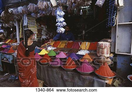 Woman standing at a market stall, Mysore, Karnataka, India View Large Photo Image Picture - Woman standing at a market stall, Mysore, Karnataka, India. Fotosearch