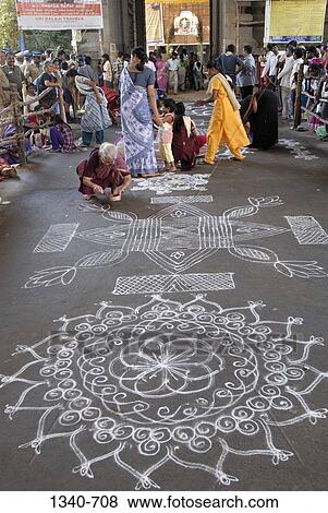 Women making kolam in front of a temple, Kapaleeshwarar Temple, Mylapore, Chennai, Tamil Nadu, India View Large Photo Image Stock Photo - Women making kolam in front of a temple, Kapaleeshwarar Temple, Mylapore, Chennai, Tamil Nadu, India. Fotosearch