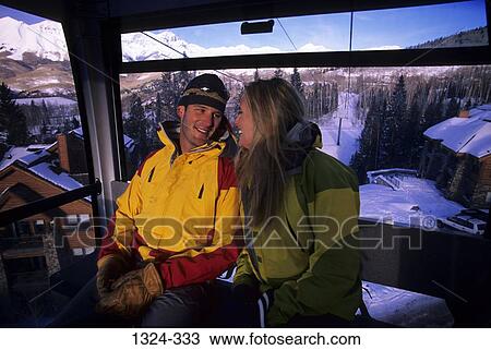 Young couple sitting in an overhead cable car, Mountain Village, Telluride, Colorado, USA View Large Photo Image Stock Image - Young couple sitting in an overhead cable car, Mountain Village, Telluride, Colorado, USA. Fotosearch