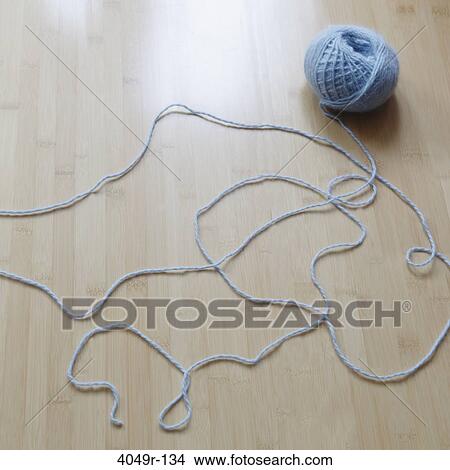 Picture - Ball of yarn unraveling. Fotosearch