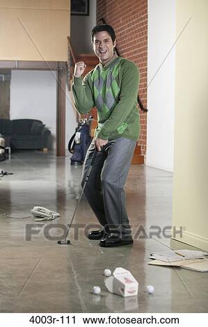 Businessman playing golf at work View Large Photo Image Stock Image - Businessman playing golf at work. Fotosearch