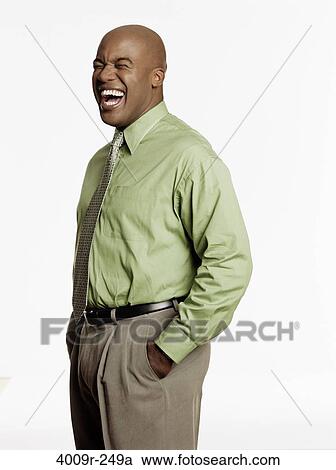 Close-up of a businessman laughing with his hands in pockets View Large Photo Image Stock Image - Close-up of a businessman laughing with his hands in pockets. Fotosearch