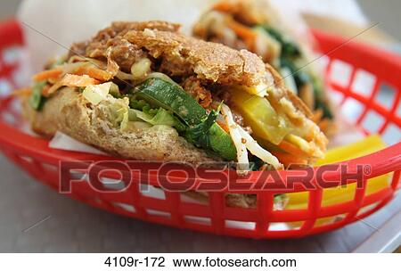 Close-up of a half eaten whole wheat sandwich in a basket View Large Photo Image Stock Image - Close-up of a half eaten whole wheat sandwich in a basket. Fotosearch