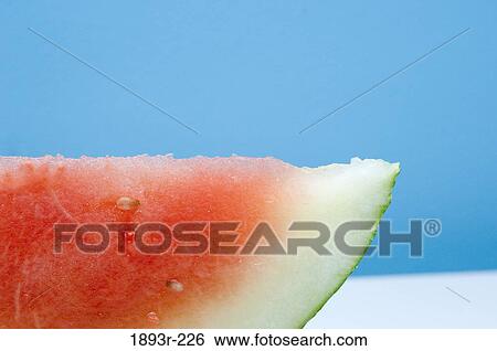 Close-up of a slice of watermelon View Large Photo Image Stock Photograph - Close-up of a slice of watermelon. Fotosearch