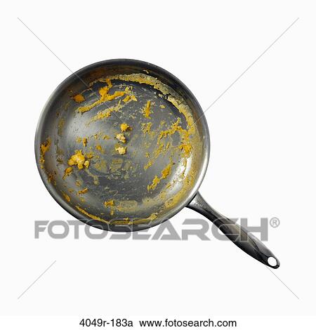 Stock Image - Close-up of an unwashed frying pan. Fotosearch
