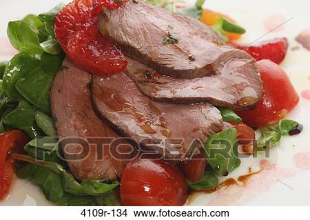 Close-up of duck meat over spinach View Large Photo Image Picture - Close-up of duck meat over spinach. Fotosearch