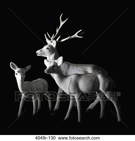 Stock Image - Close-up of figurines of deer family. Fotosearch
