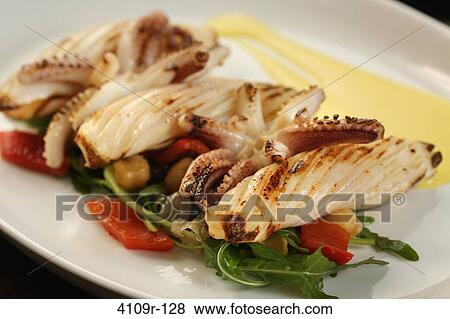 Close-up of grilled squid served in a plate View Large Photo Image Stock Photo - Close-up of grilled squid served in a plate. Fotosearch