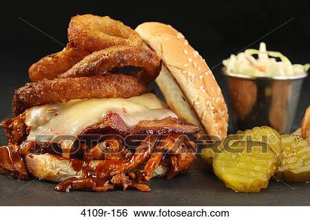 Close-up of pulled pork sandwich with coleslaw View Large Photo Image Stock Photograph - Close-up of pulled pork sandwich with coleslaw. Fotosearch