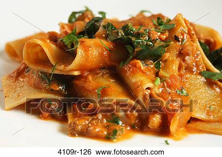 Close-up of Tagliatelle pasta served in a plate View Large Photo Image Stock Photograph - Close-up of Tagliatelle pasta served in a plate. Fotosearch
