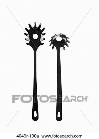 Close-up of two plastic spaghetti spoons View Large Photo Image Stock Image - Close-up of two plastic spaghetti spoons. Fotosearch
