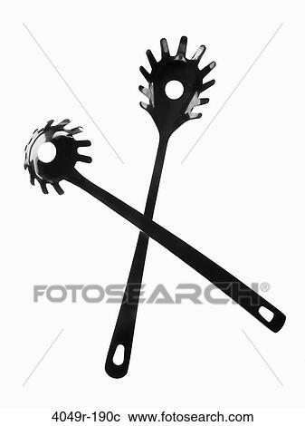 Close-up of two plastic spaghetti spoons View Large Photo Image Stock Image - Close-up of two plastic spaghetti spoons. Fotosearch