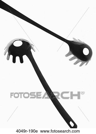 Close-up of two plastic spaghetti spoons View Large Photo Image Stock Image - Close-up of two plastic spaghetti spoons. Fotosearch