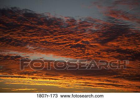 Clouds in the sky at sunset View Large Photo Image Stock Image - Clouds in the sky at sunset. Fotosearch
