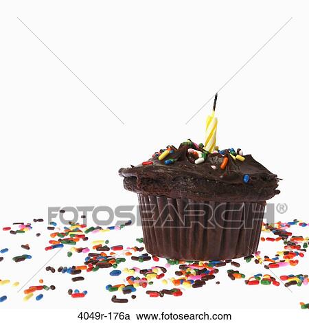 Cupcake with a candle and sprinkles View Large Photo Image Stock Image - Cupcake with a candle and sprinkles. Fotosearch