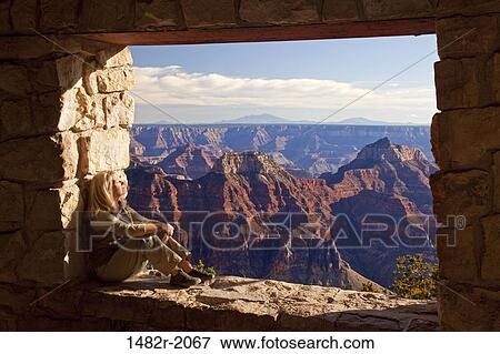 Female hiker sitting on a wall in an arid landscape, North Rim, Grand Canyon National Park, Arizona, USA View Large Photo Image Stock Photo - Female hiker sitting on a wall in an arid landscape, North Rim, Grand Canyon National Park, Arizona, USA. Fotosearch