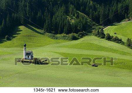 Stock Image - High angle view of a church on a landscape, St. Johann Church, Funes Valley, Dolomites, Trentino-Alto-Adige, Italy. Fotosearch