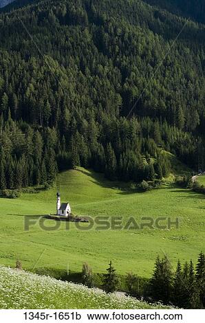 Stock Image - High angle view of a church on a landscape, St. Johann Church, Funes Valley, Dolomites, Trentino-Alto-Adige, Italy. Fotosearch