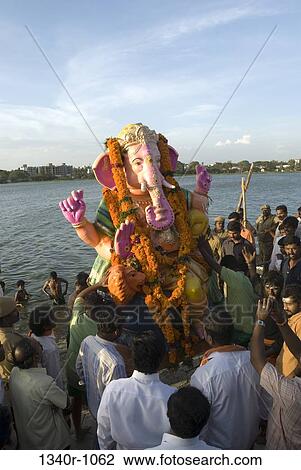 People at the immersion ceremony of Lord Ganesha, Muthannankulam, Coimbatore, Tamil Nadu, India View Large Photo Image Stock Image - People at the immersion ceremony of Lord Ganesha, Muthannankulam, Coimbatore, Tamil Nadu, India. Fotosearch