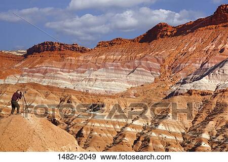 Photographer taking a picture in a desert, Paria River, Utah, USA View Large Photo Image Stock Photo - Photographer taking a picture in a desert, Paria River, Utah, USA. Fotosearch