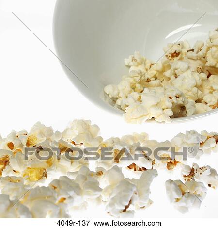 Popcorn falling out of a bowl View Large Photo Image Stock Photo - Popcorn falling out of a bowl. Fotosearch
