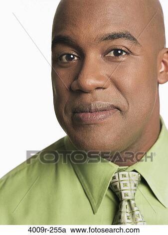 Stock Image - Portrait of a businessman smiling. Fotosearch