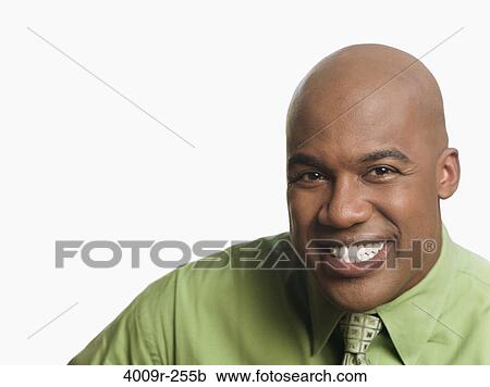 Stock Image - Portrait of a businessman smiling. Fotosearch