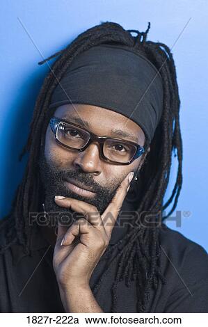 Portrait of a mid adult man thinking View Large Photo Image Stock Image - Portrait of a mid adult man thinking. Fotosearch
