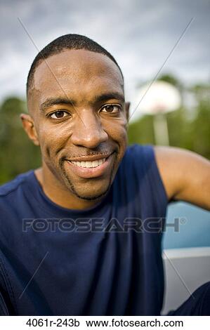 Stock Image - Portrait of a young man smiling. Fotosearch