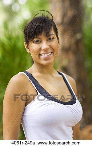 Portrait of a young woman smiling View Large Photo Image Stock Image - Portrait of a young woman smiling. Fotosearch