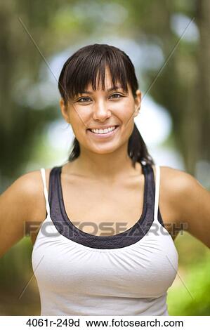 Portrait of a young woman smiling View Large Photo Image Stock Image - Portrait of a young woman smiling. Fotosearch