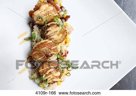 Scallops served with fried rice View Large Photo Image Stock Photograph - Scallops served with fried rice. Fotosearch