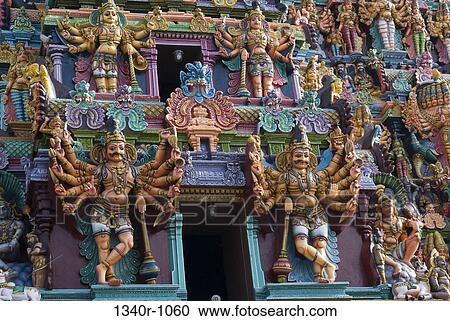 Stock Image - Stucco figures of deities on a temple, Meenakshi Amman Temple, Madurai, Tamil Nadu, India. Fotosearch