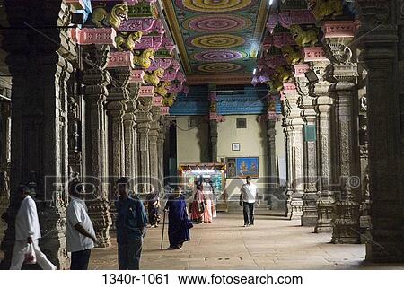 Tourists walking in a corridor of a temple, Meenakshi Amman Temple, Madurai, Tamil Nadu, India View Large Photo Image Stock Image - Tourists walking in a corridor of a temple, Meenakshi Amman Temple, Madurai, Tamil Nadu, India. Fotosearch