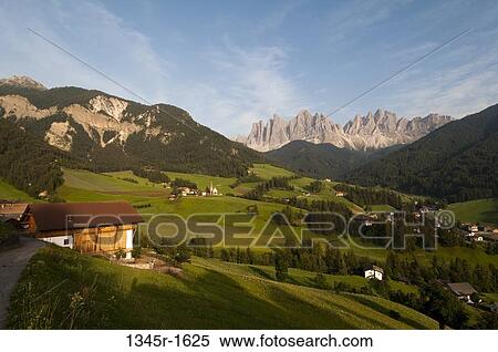 Village with mountain range in the background, Santa Maddalena, Funes Valley, Dolomites, Trentino-Alto-Adige, Italy View Large Photo Image Stock Photography - Village with mountain range in the background, Santa Maddalena, Funes Valley, Dolomites, Trentino-Alto-Adige, Italy. Fotosearch