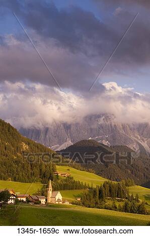 Village with mountain range on a landscape, Santa Maddalena, Funes Valley, Dolomites, Trentino-Alto-Adige, Italy View Large Photo Image Stock Image - Village with mountain range on a landscape, Santa Maddalena, Funes Valley, Dolomites, Trentino-Alto-Adige, Italy. Fotosearch