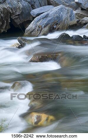 Stock Image - Water flowing through rocks, Kings River, Giant Sequoia National Monument, Kings Canyon National Park, Sierra Nevada, California, USA. Fotosearch