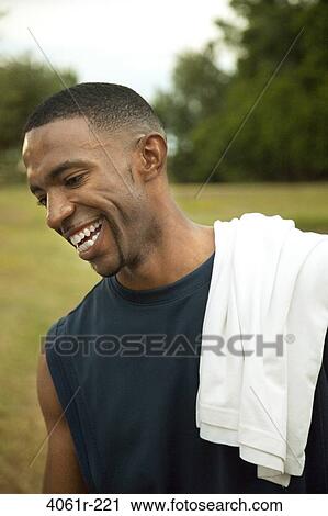 Young man laughing View Large Photo Image Stock Image - Young man laughing. Fotosearch