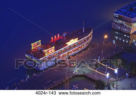 Aerial view of a tourboat docked at a port, Renaissance Riverside Hotel, Ho Chi Minh City, Vietnam View Large Photo Image Stock Image - Aerial view of a tourboat docked at a port, Renaissance Riverside Hotel, Ho Chi Minh City, Vietnam. Fotosearch