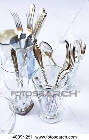 Antique silverware and glasses on a dining table View Large Photo Image Stock Image - Antique silverware and glasses on a dining table. Fotosearch